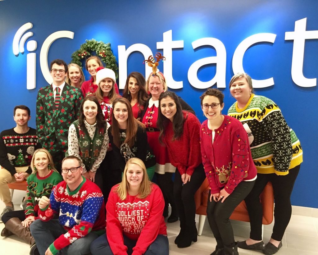 Group of Employees in front of iContact logo