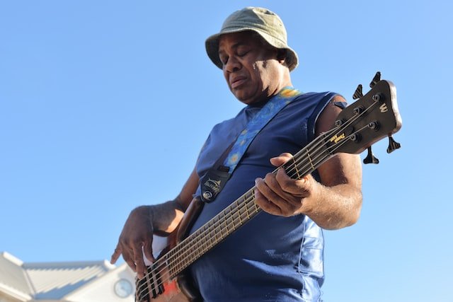 Live musician playing guitar on Palafox Street in Downtown Pensacola