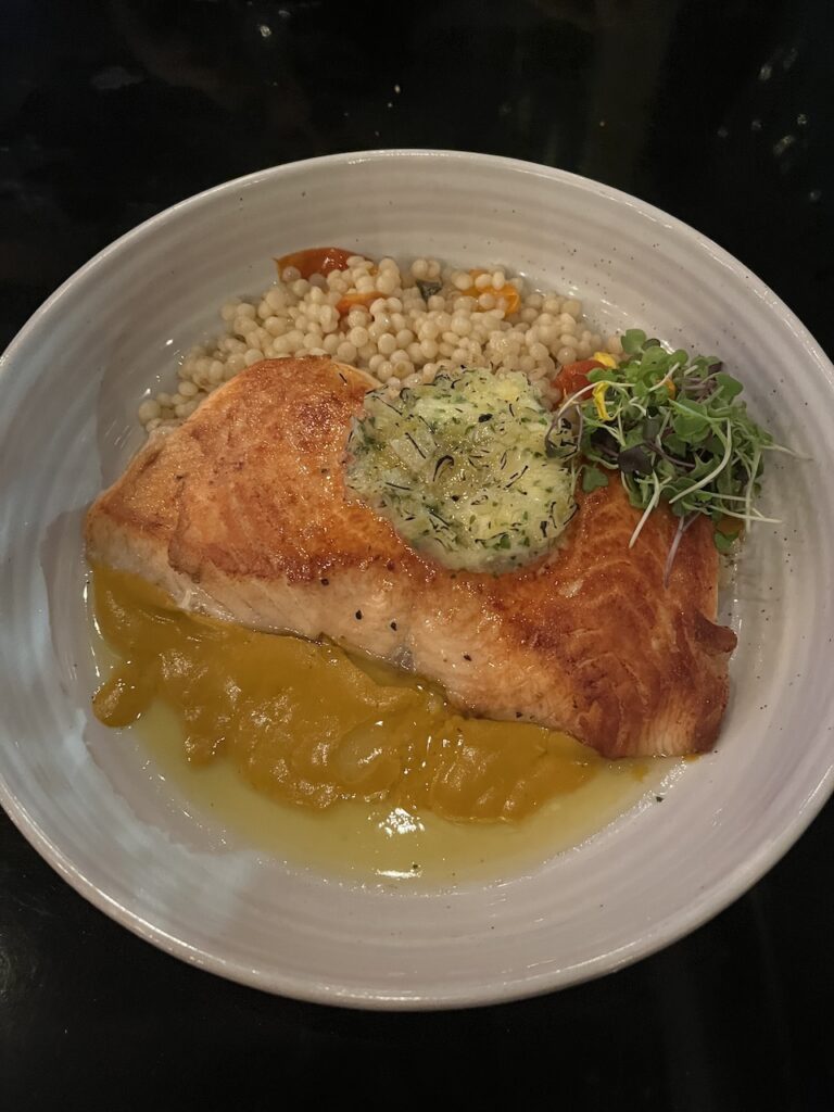 Plate of Salmon with Israeli Couscous at Agapi Bistro in Pensacola