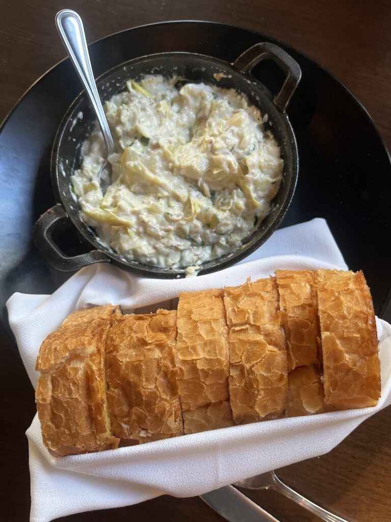 Hot Artichoke Dip & French Bread Appetizer at The Burrow in Pensacola Florida