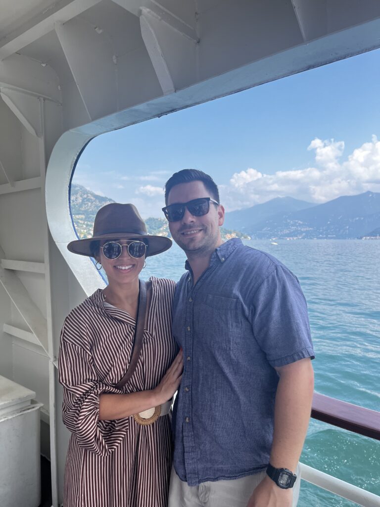 Couple rides the public ferry transfer from Como to Bellagio in northern Italy