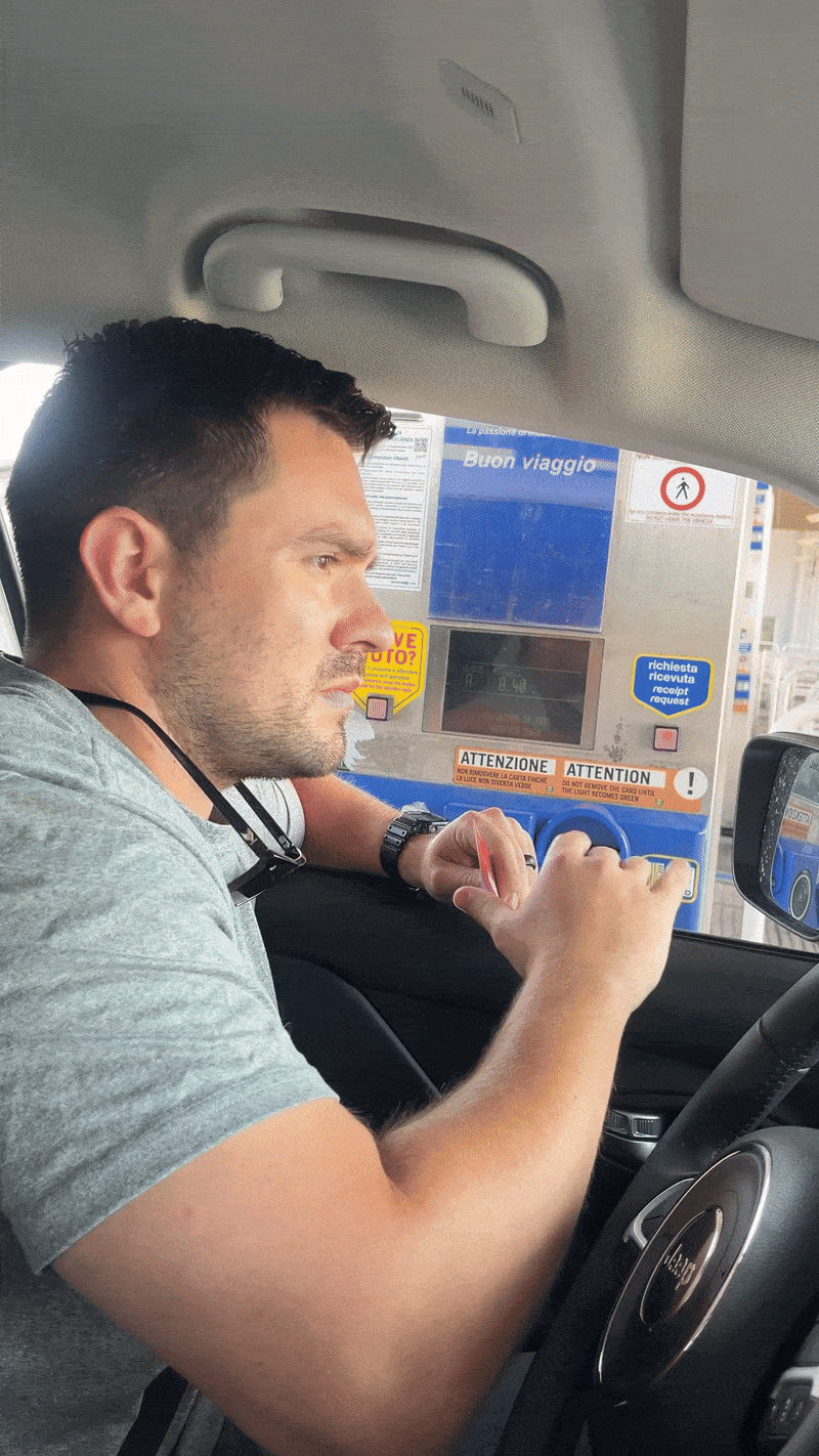 Man pays at toll booth on the way to the Dolomites and drives away | two week itinerary in northern Italy by train and car