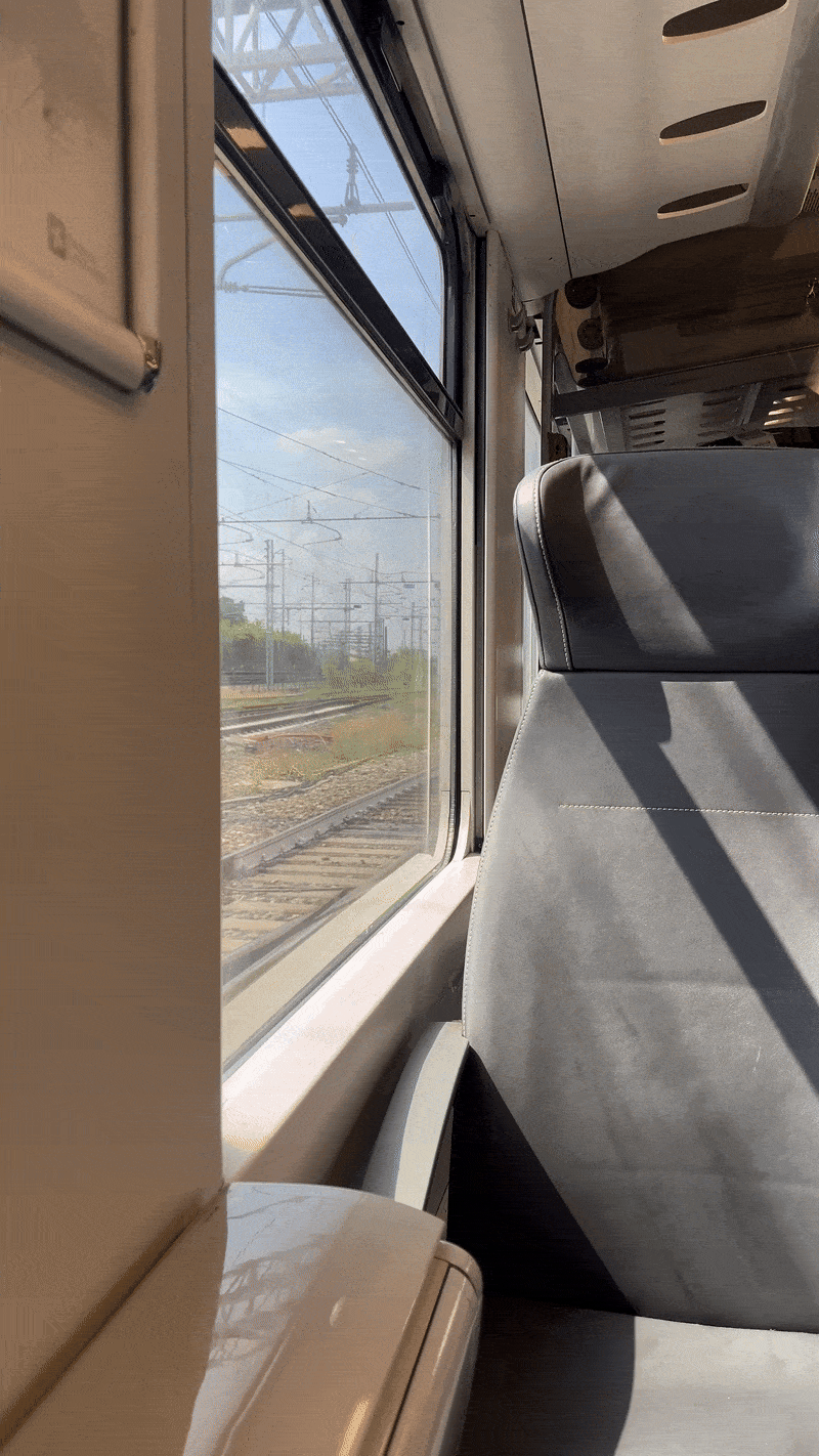 Empty window seat on a train | Traveling northern Italy by train 